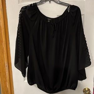 Black blouse with ladder sleeves